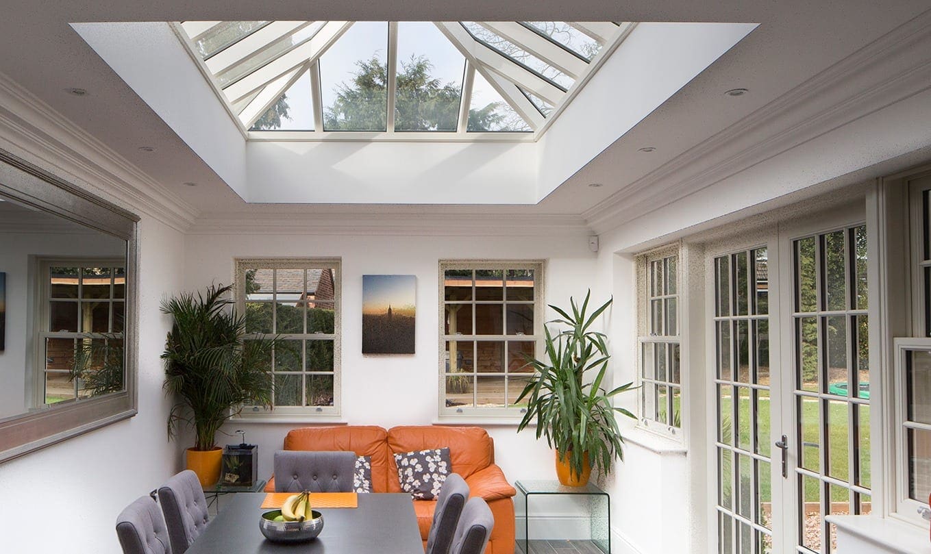 indoor shot of a modern office with roof lantern and wooden windows