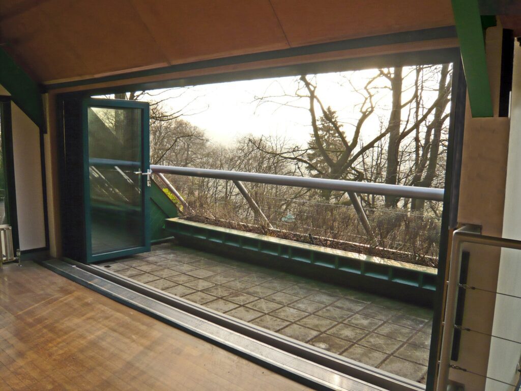 Interior view of an aluminium bifold door at the Heights of Abraham in Matlock Bath, Derbyshire, showcasing unobstructed views and low-threshold accessibility.