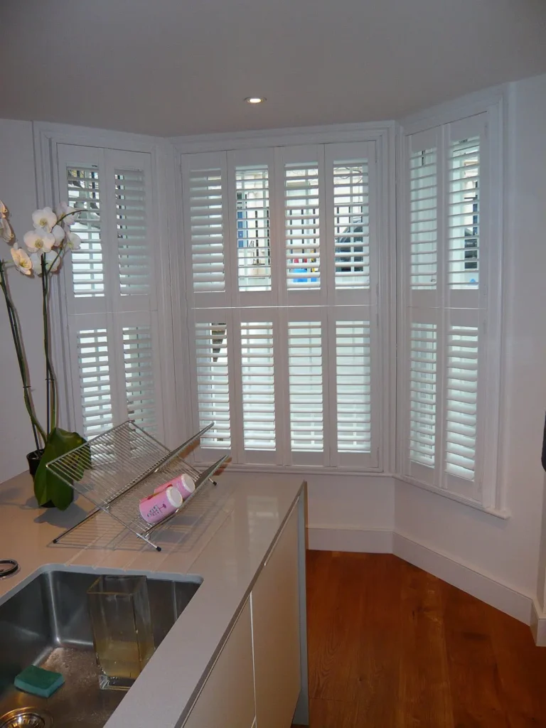 Chatsworth sliding sash bay window internal view white internal shutters blinds