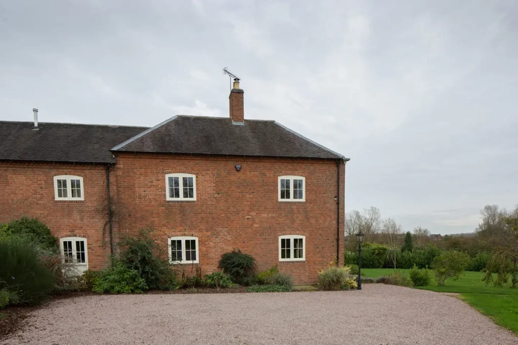 Hardwick casement windows Georgian bars astragals painted white elevation brick house radial top scribes