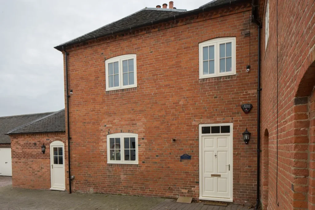 Hardwick casement windows Georgian bars astragals painted white elevation brick house radial top scribes 2