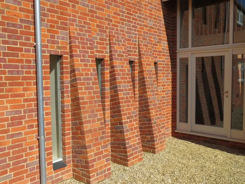 Direct glazed hardwick windows hidden in reveal brickwork red brick