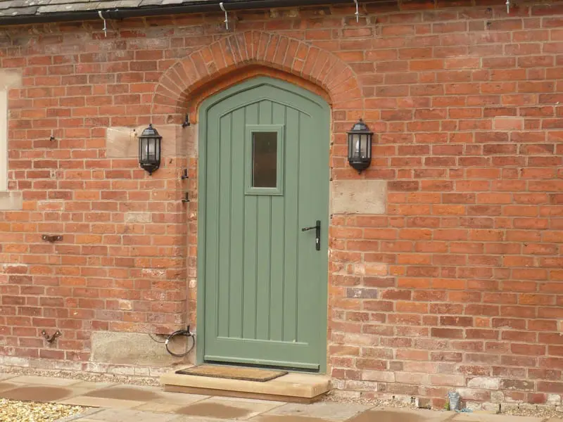 Gothic arched Melbourne door vision panel booth painted brick stone cill barn conversion