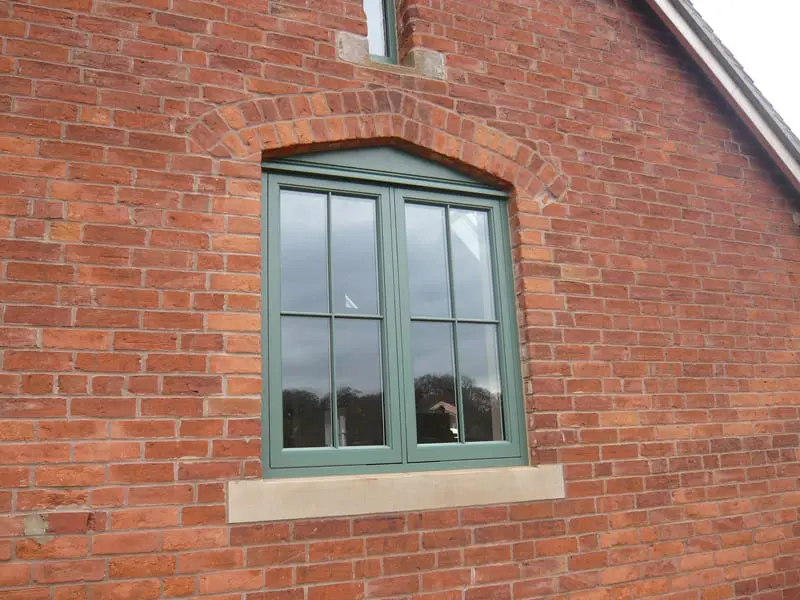 Hardwick casement Booth painted brick barn conversion crucifix astragal double casement radial top scribe