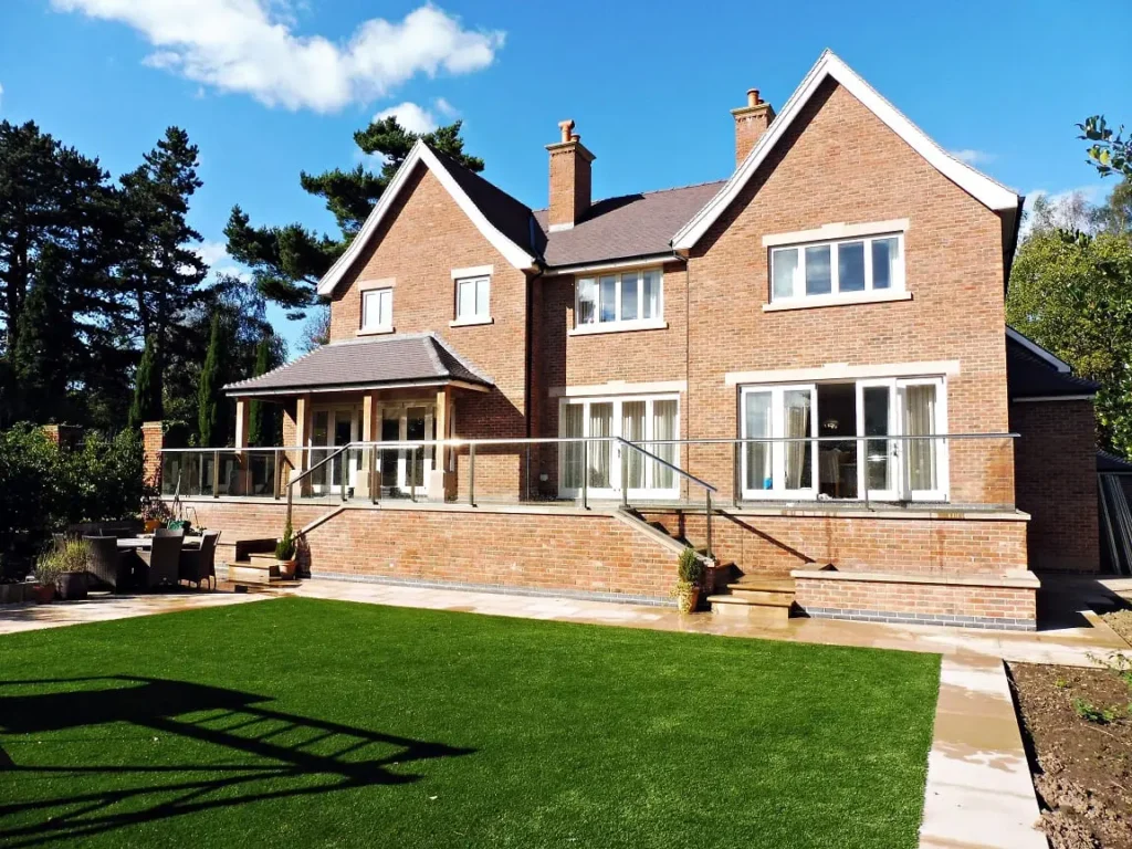 Hardwick casement windows square lead glass elevation painted strutt yellow Tutbury bifold doors reclaimed brick building