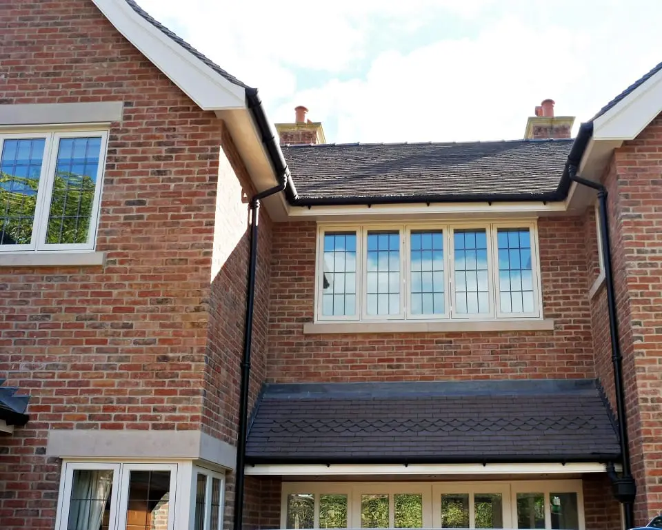 Hardwick casement windows square lead glass painted strutt yellow 5 five panel casement brick building