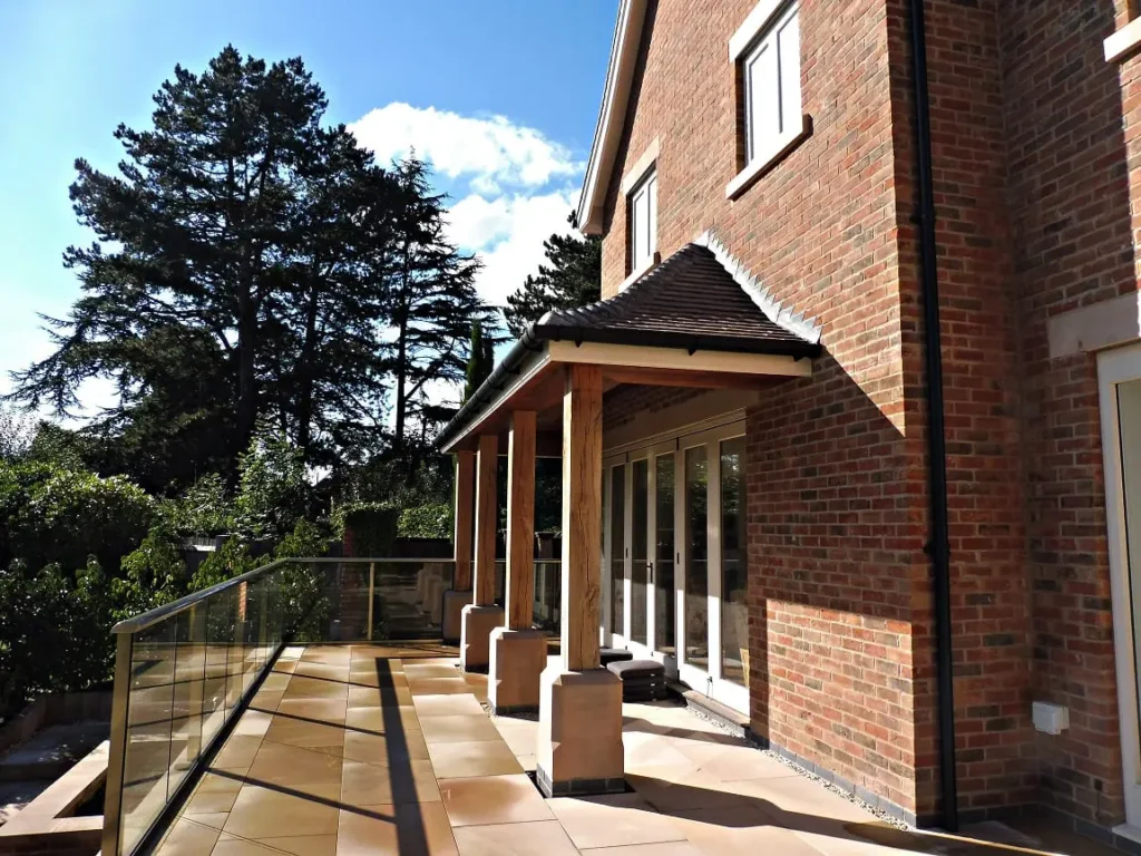 Tutbury bifold door 6 six panel painted strutt yellow clear glass closed external view Oak canopy roof brick building