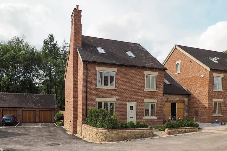 Armsgate Development house with accoya front door and traditional windows