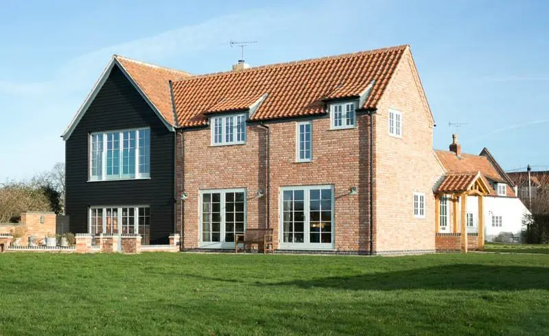 Replacement Windows White Cottage Side Elevation with Hardwick casement and Melbourne French doors with brick work and black cladding timber