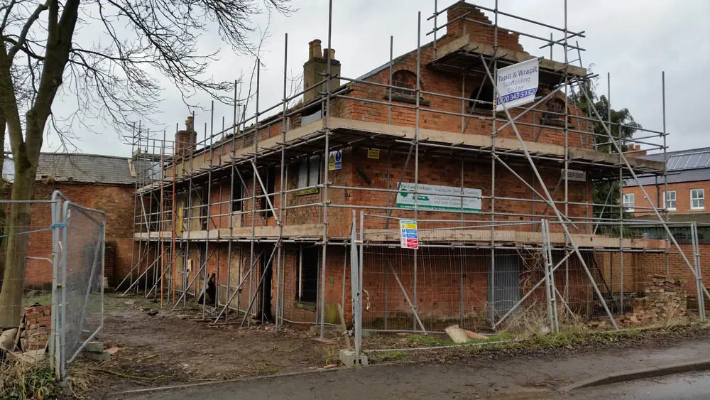 Canal Side Cottages: angled shot of the cottages during restoration