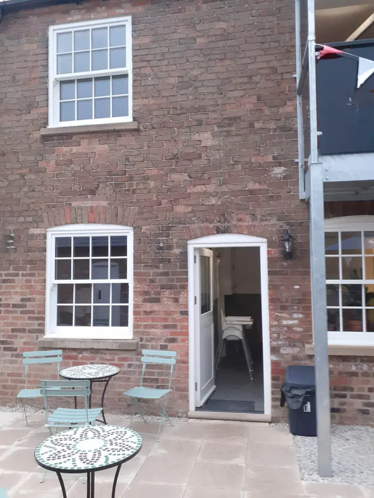 Canal Side Cottages: tighter shot from the side showing melbourne door and patio