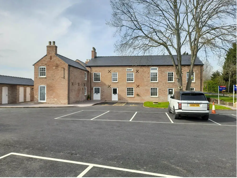 Canal Side Cottages: long shot of the cottages in a after restoration