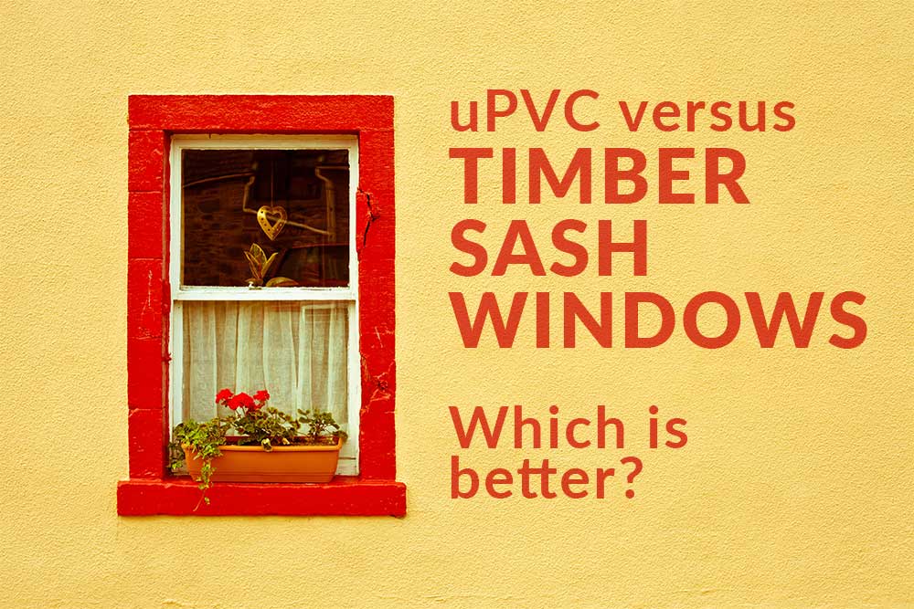 Bright yellow exterior wall with a red-trimmed sash window, featuring a flower box and heart-shaped ornament, alongside bold red text reading "uPVC versus TIMBER SASH WINDOWS – Which is better?"