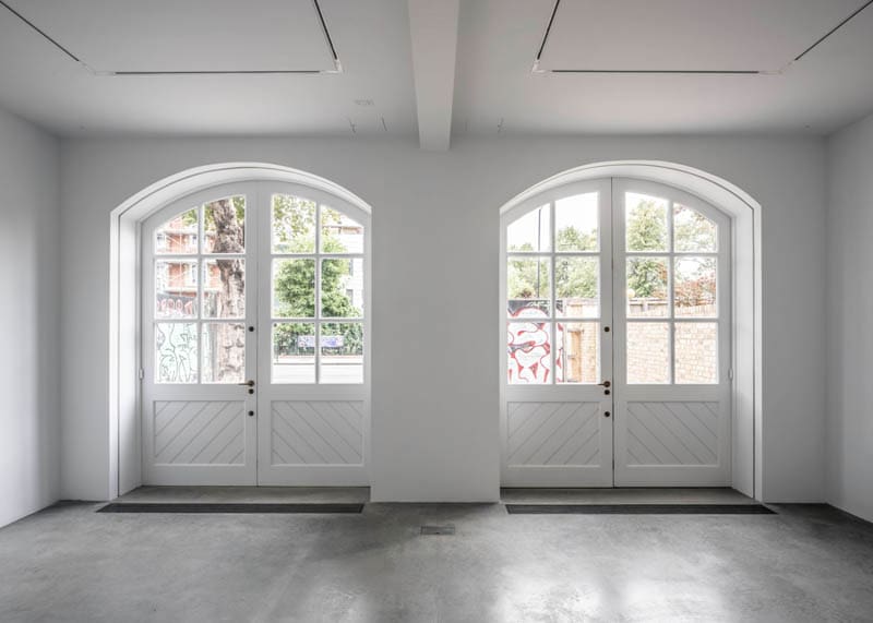 South London Gallery Fire Station: head on shot of the heritage doors from inside the gallery