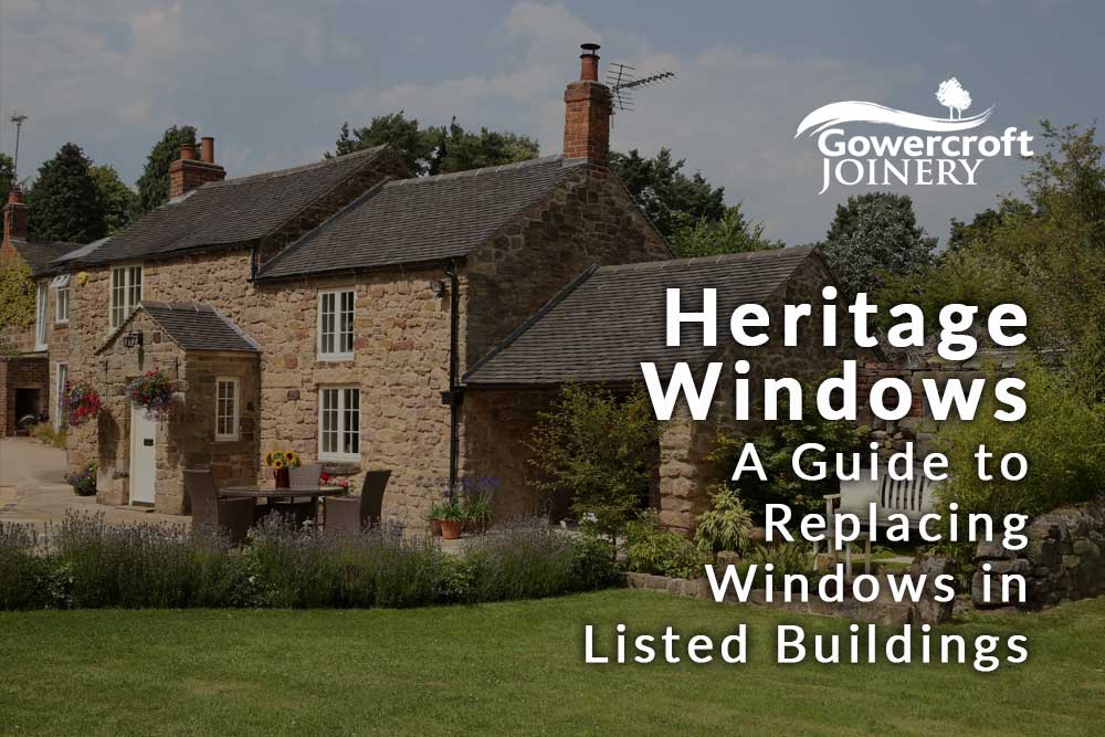 Traditional stone cottage with white heritage-style timber windows, used as the cover image for Gowercroft Joinery's guide to replacing windows in listed buildings.
