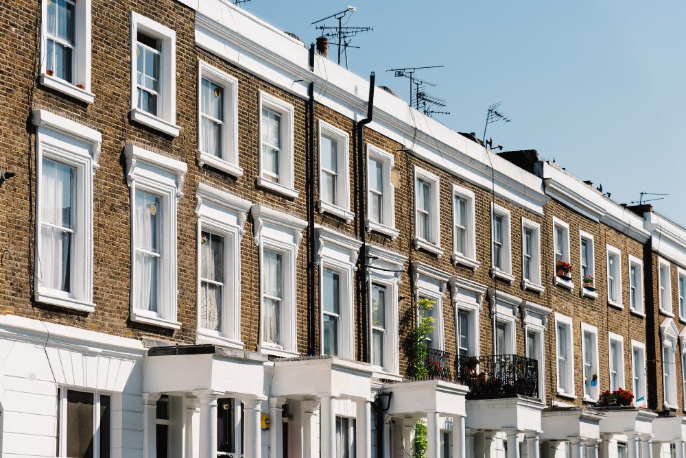 A row of traditional Victorian terraced houses with sash windows, showcasing typical architecture found in conservation areas and listed buildings.