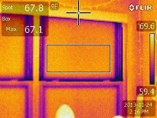 Thermal imaging shows heat lost around the edges of a window pane, also known as a thermal bridge.